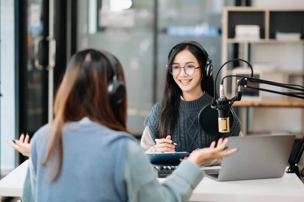 asian-woman-wearing-headphones-and-doing-a-live-po-LR2P7LV.jpg